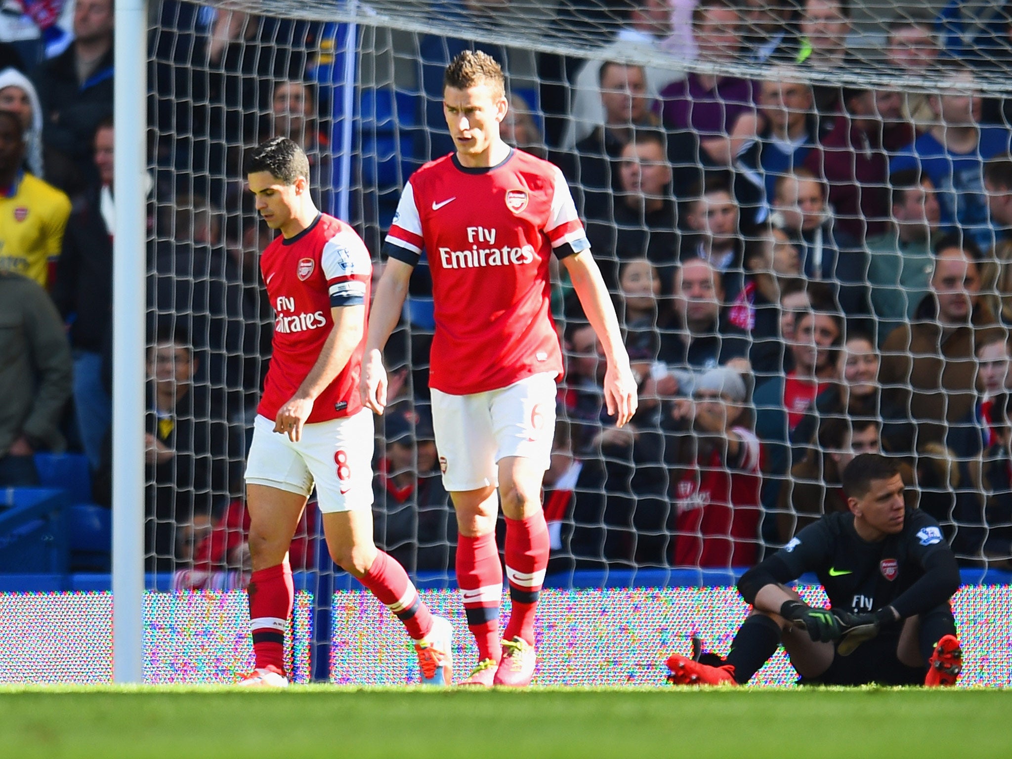 A dejected Mikel Arteta and Laurent Koscielny of Arsenal after conceding a fourth goal during the Premier League match against Chelsea