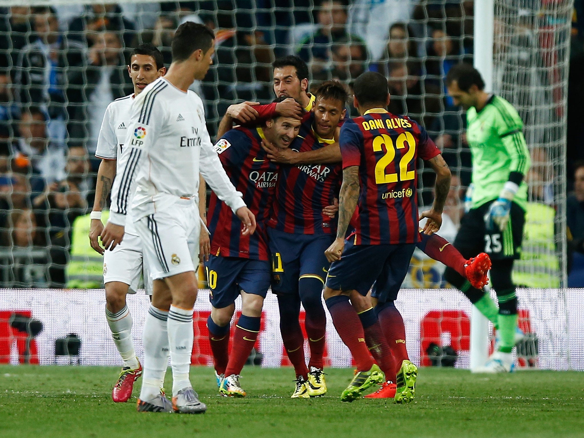 Cristiano Ronaldo looks on as Barcelona celebrate at the Bernabeu