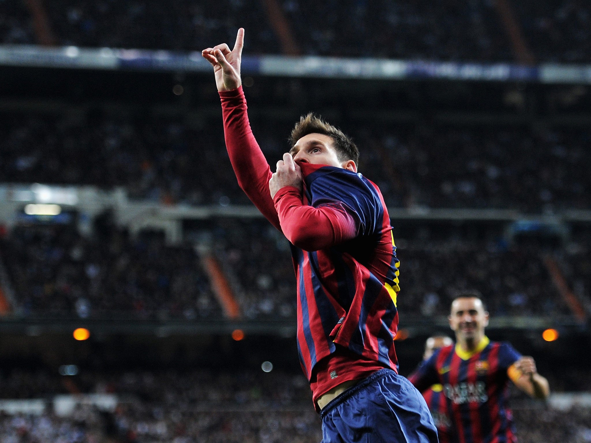 Lionel Messi celebrates after scoring at the Bernabeu