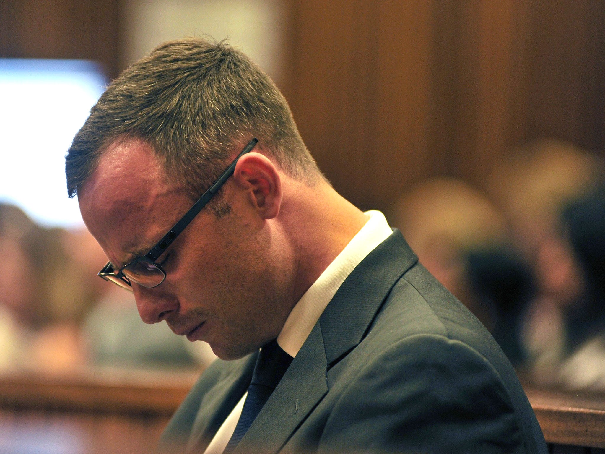 Oscar Pistorius shedding tears as he sits in the dock during his ongoing murder trial in Pretoria