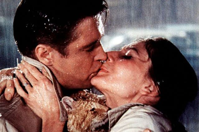 Celluloid snogging: George Peppard and Audrey Hepburn get lippy in Breakfast At Tiffany's