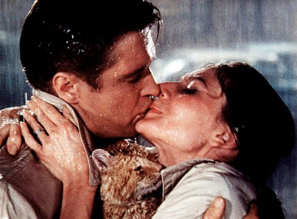 Celluloid snogging: George Peppard and Audrey Hepburn get lippy in Breakfast At Tiffany's