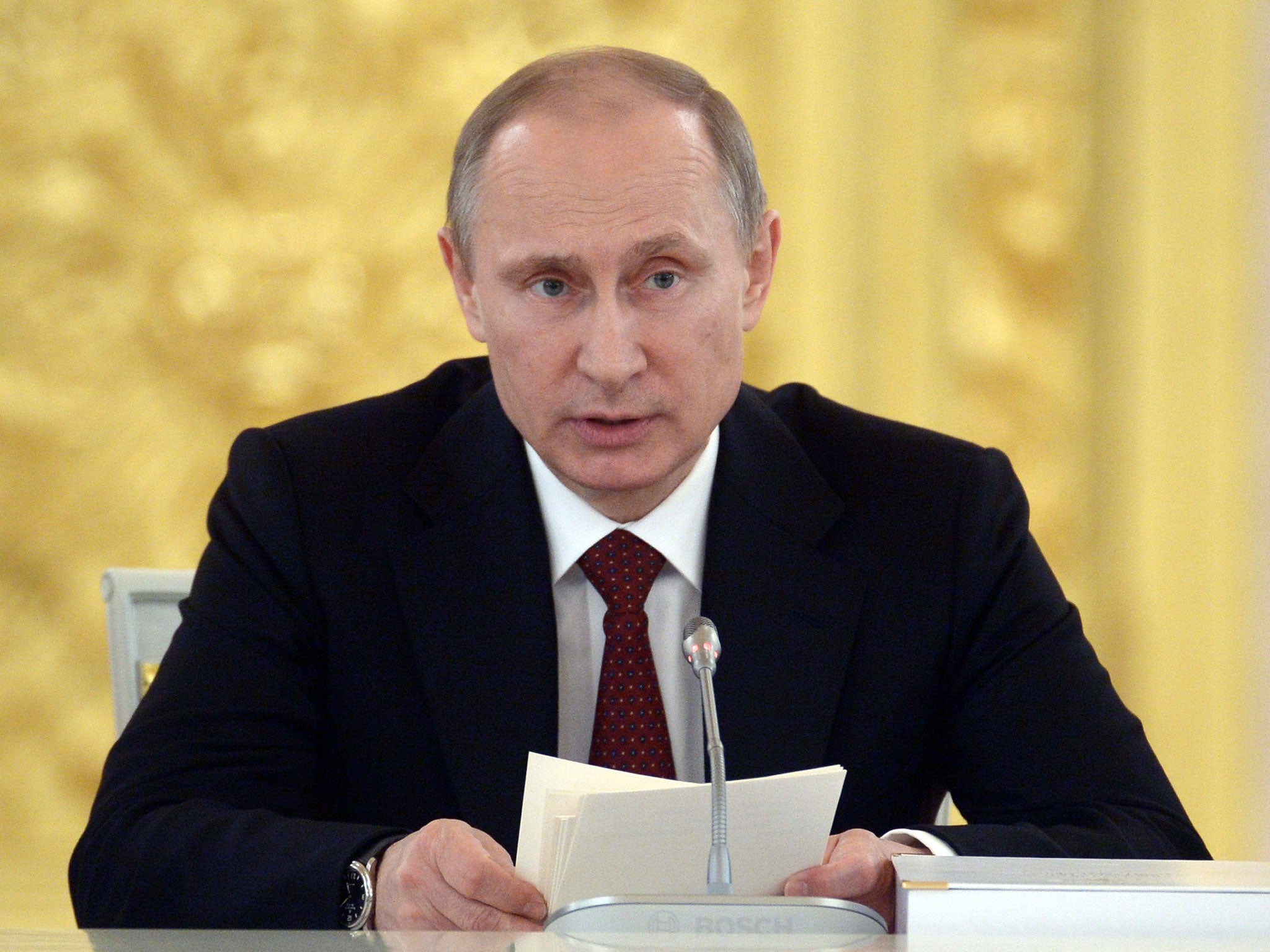 Russian President Vladimir Putin speaks at a government meeting at the Kremlin in Moscow on 24 March, 2014