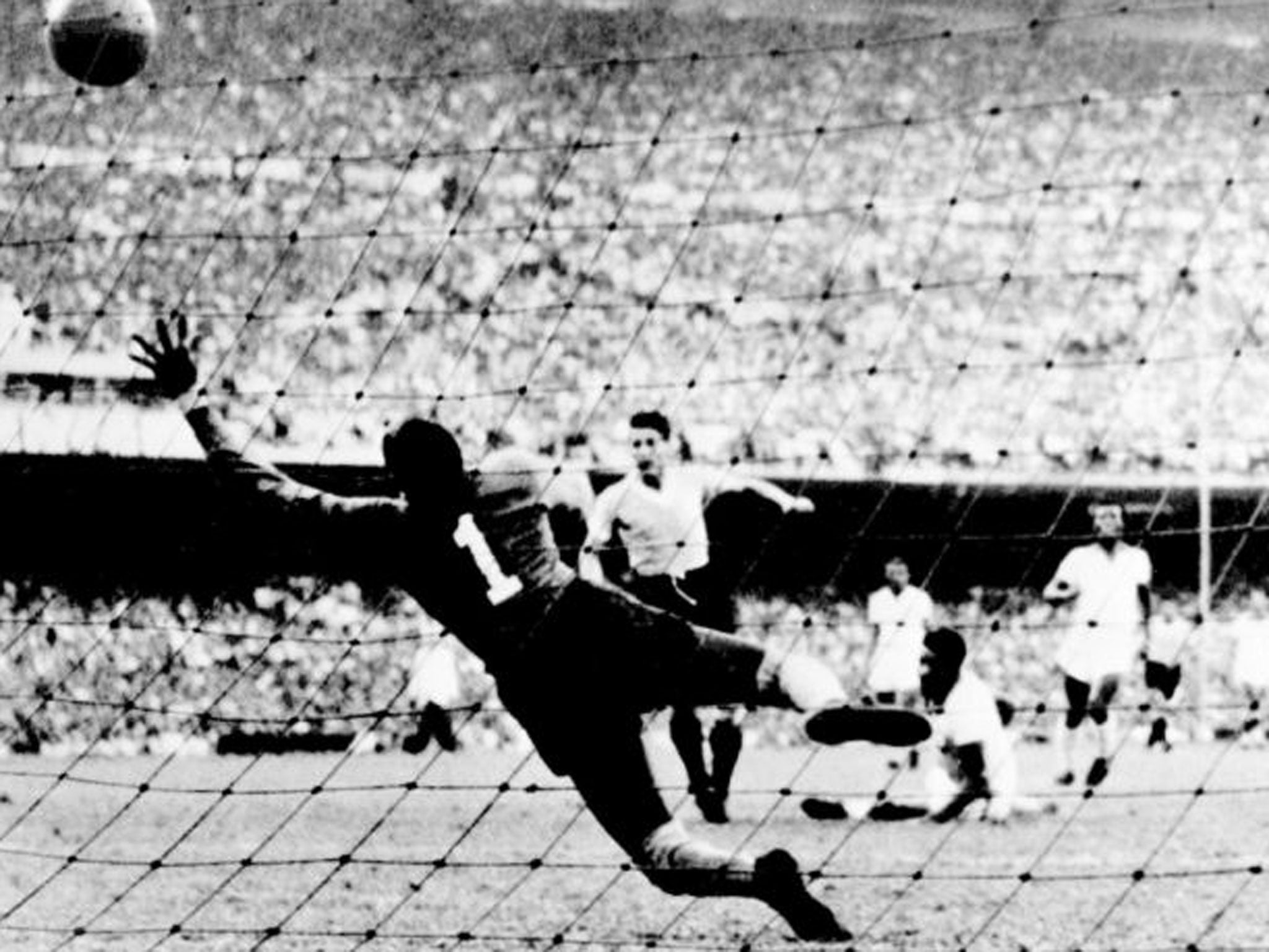 Uruguay striker Juan Alberto Schiaffino scores past Brazil’s goalkeeper Barbosa to make it 1-1 in the 1950 World Cup final in the Maracana