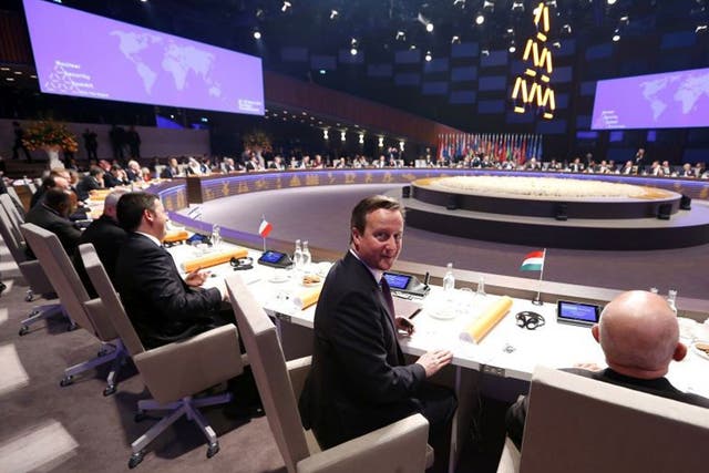 David Cameron in the plenary room at the Nuclear Security Summit 2014, where female catering staff are not setting foot. 