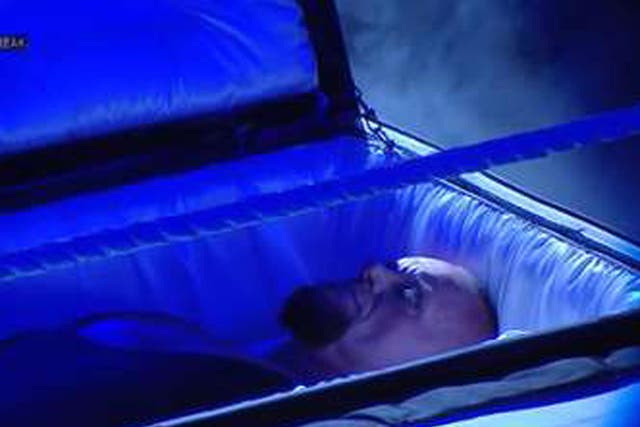 The Undertaker emerges from a casket to confront Brock Lesnar