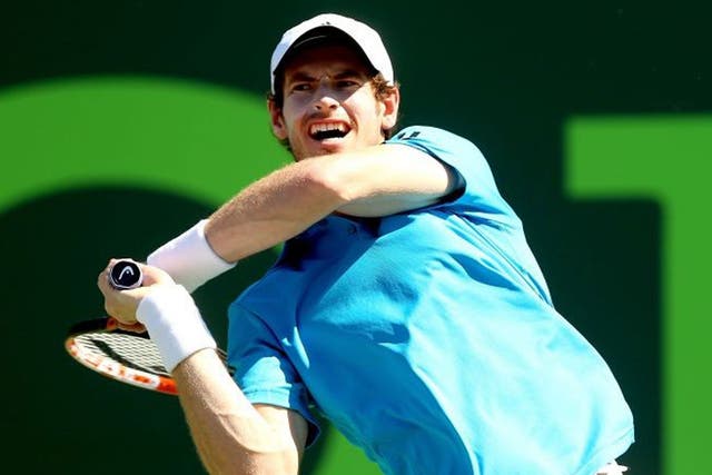 Andy Murray returns a shot to Jo-Wilfired Tsonga during the Sony Open at the Crandon Park Tennis Center on March 25, 2014 in Key Biscayne, Florida