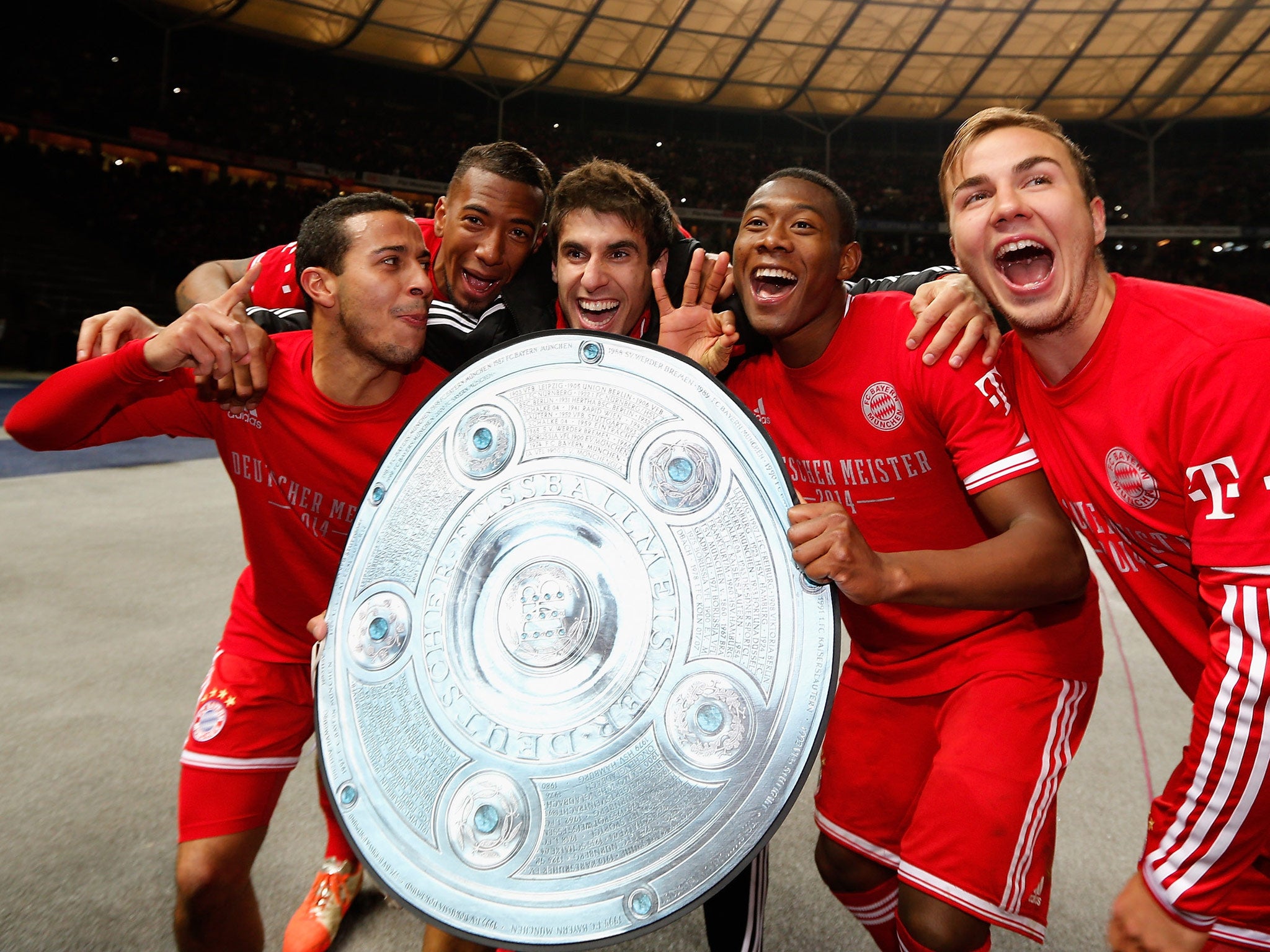 Thiago Alcantara, David Alaba, Javier Martínez Aguinaga and Mario Goetze of Bayern Muenchen celebrate winning the Bundesliga