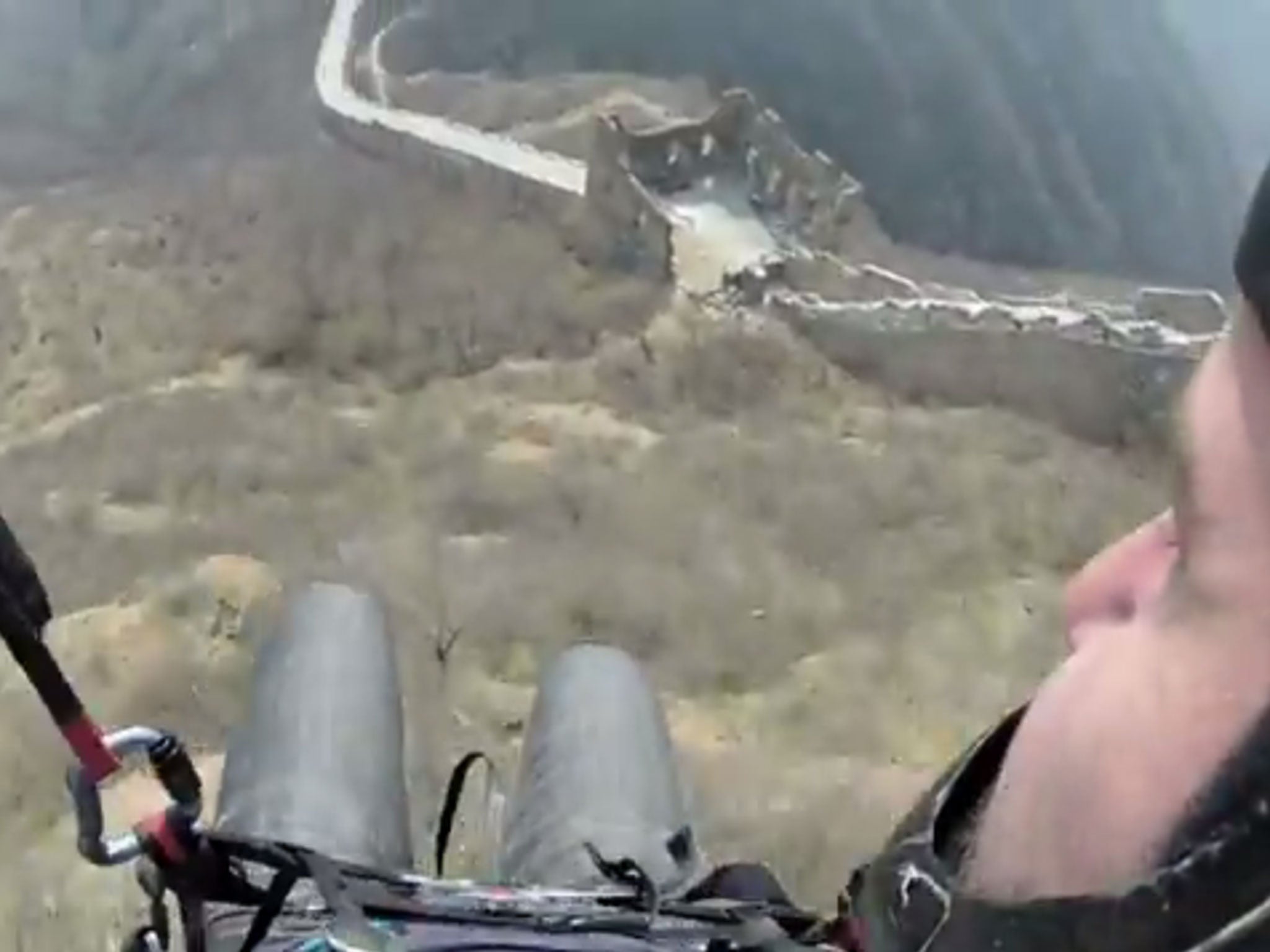 A still from a video uploaded by Jon Potter as he speed-flies over the Great Wall of China. He claims he is the first person to do this.