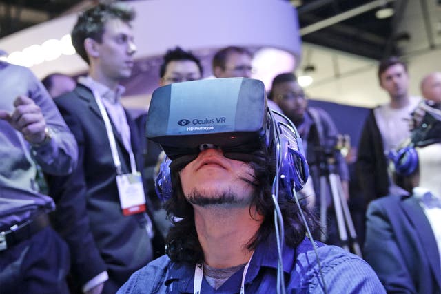 A man tries out a Oculus Rift virtual reality headset at the International Consumer Electronics Show (CES) in Las Vegas earlier this year