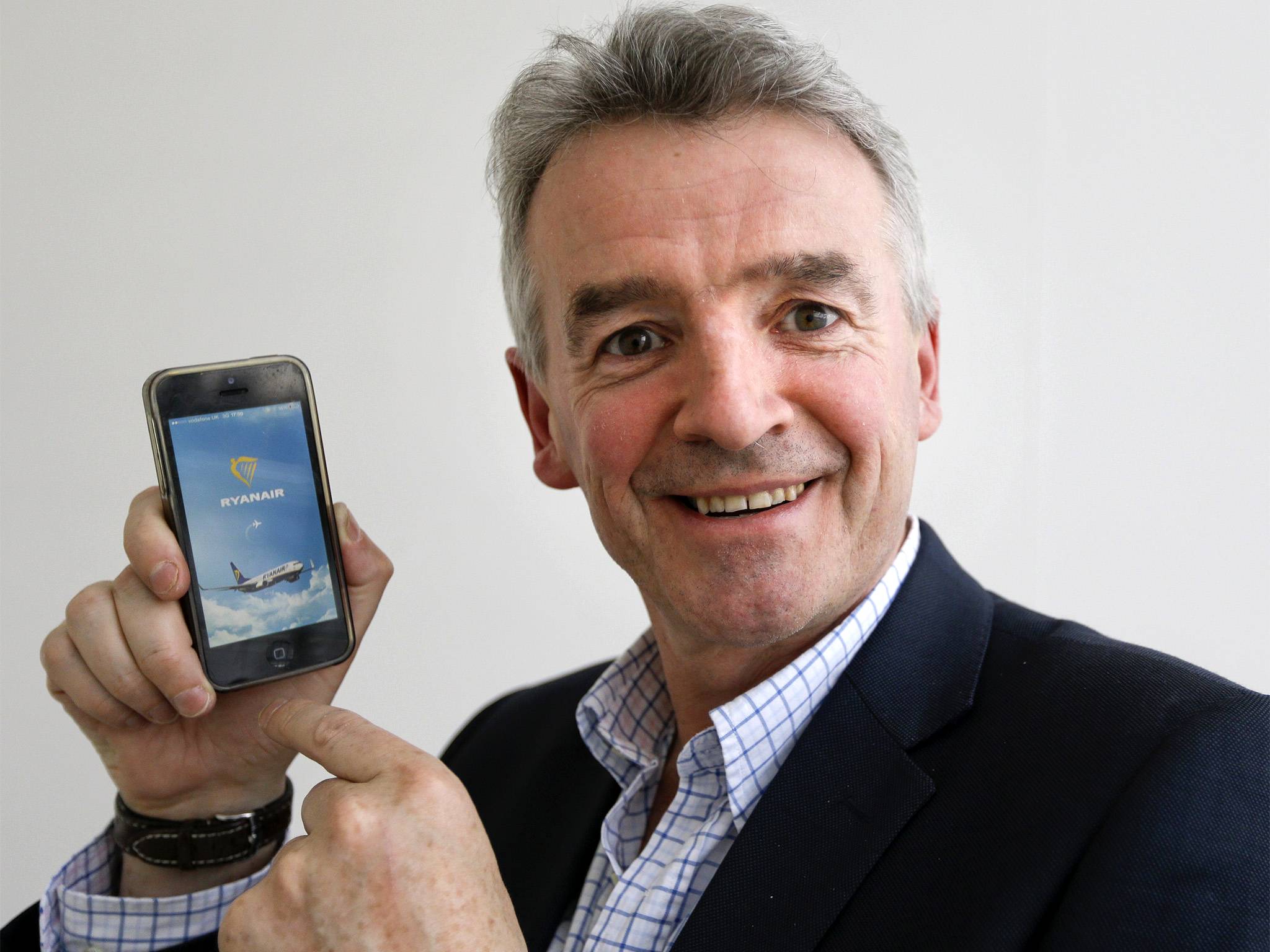 Michael O'Leary displays the new Ryanair smart phone App