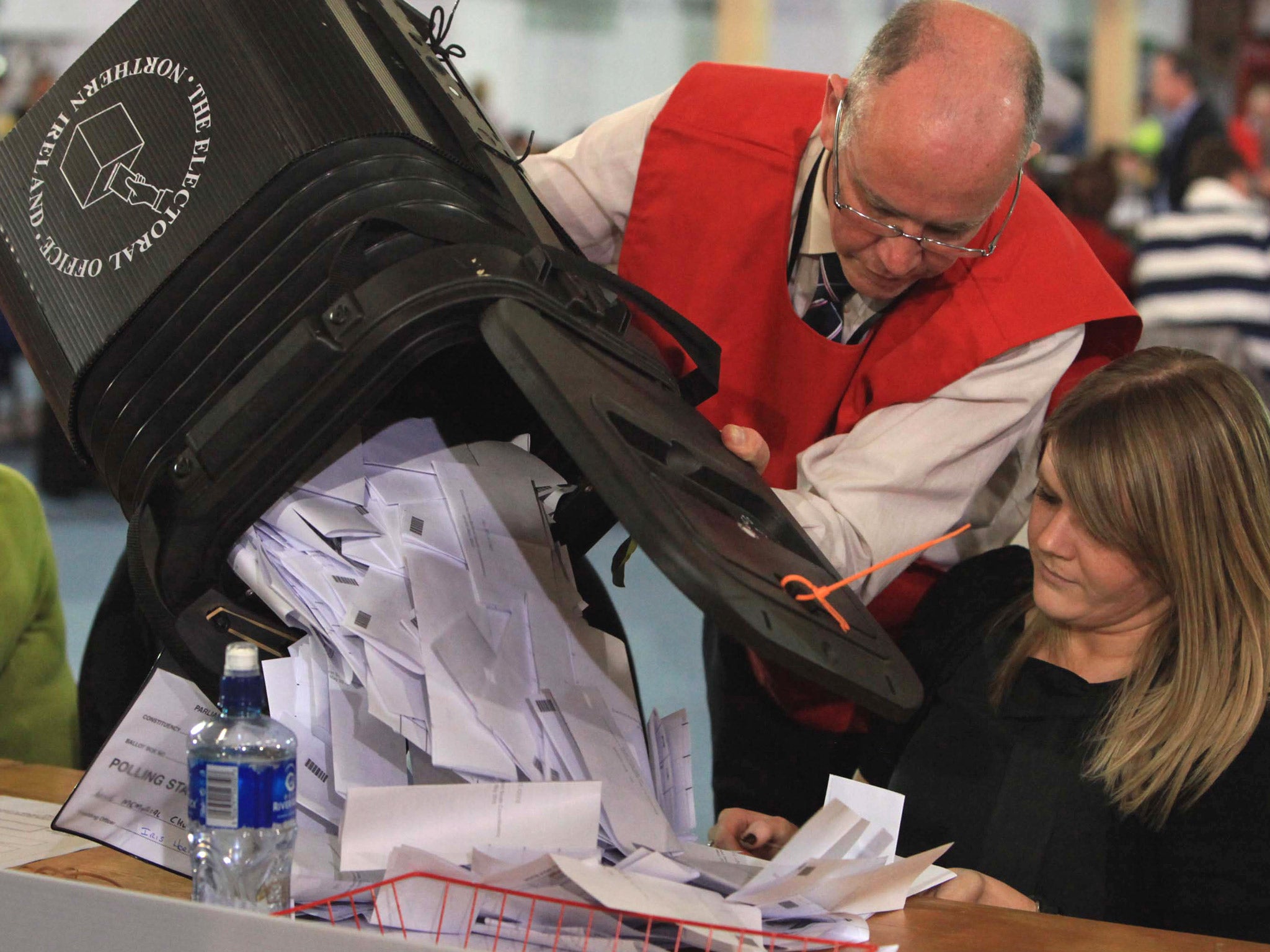 A ballot box is emptied for counting of votes during the 2010 general election
