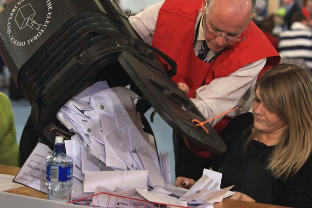 A ballot box is emptied for counting of votes during the 2010 general election