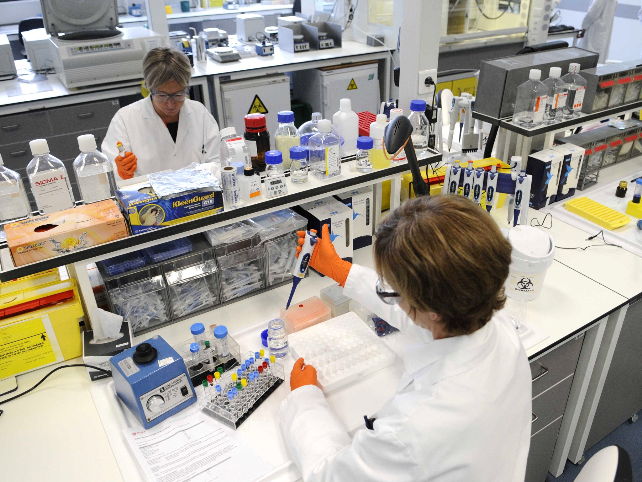 Researchers in a GlaxoSmithKline laboratory