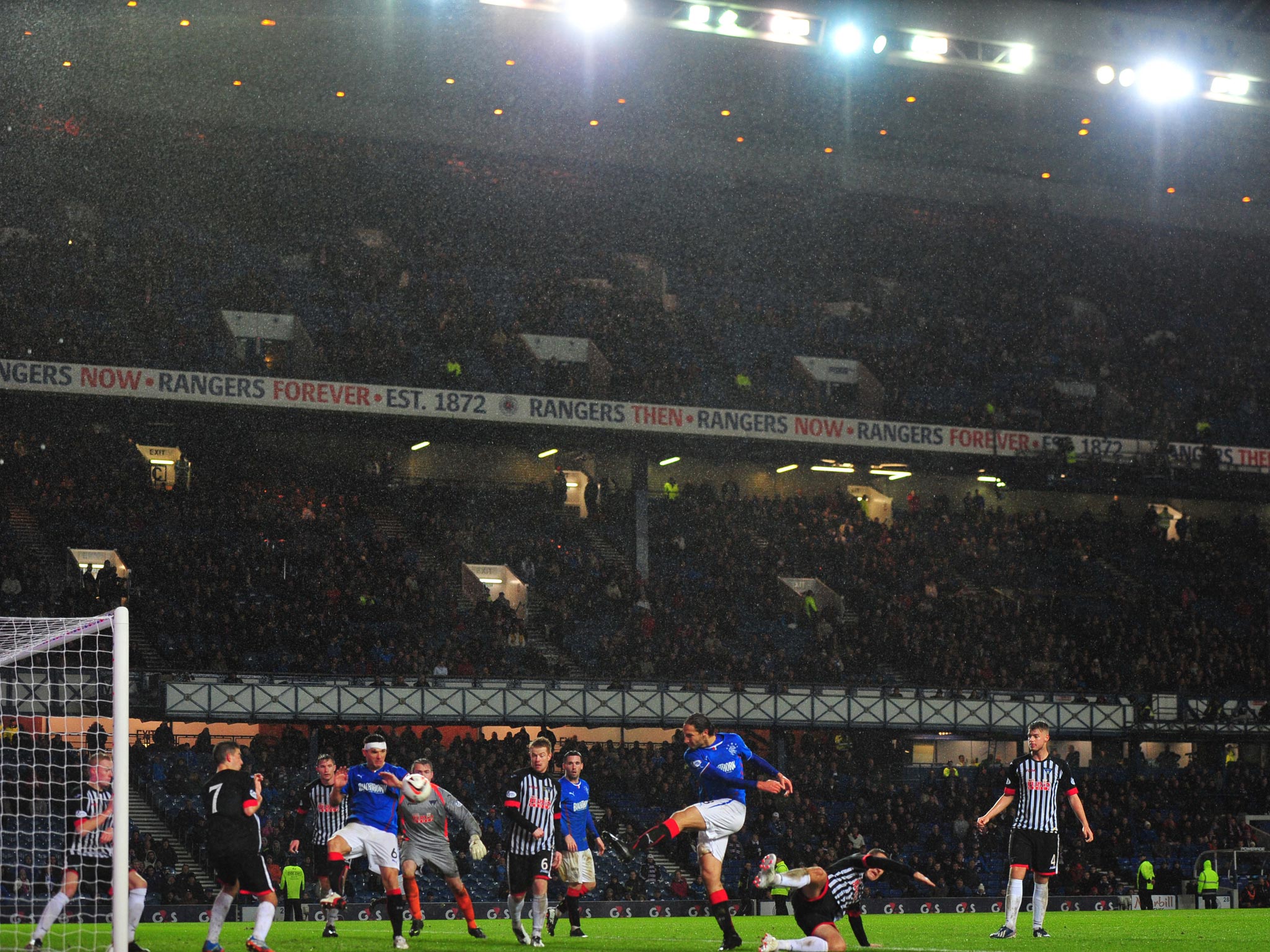 Bilel Mohsni of Rangers scores Rangers' third goal during a rain storm at Ibrox stadium during the Scottish League One match between Rangers and Dunfermline