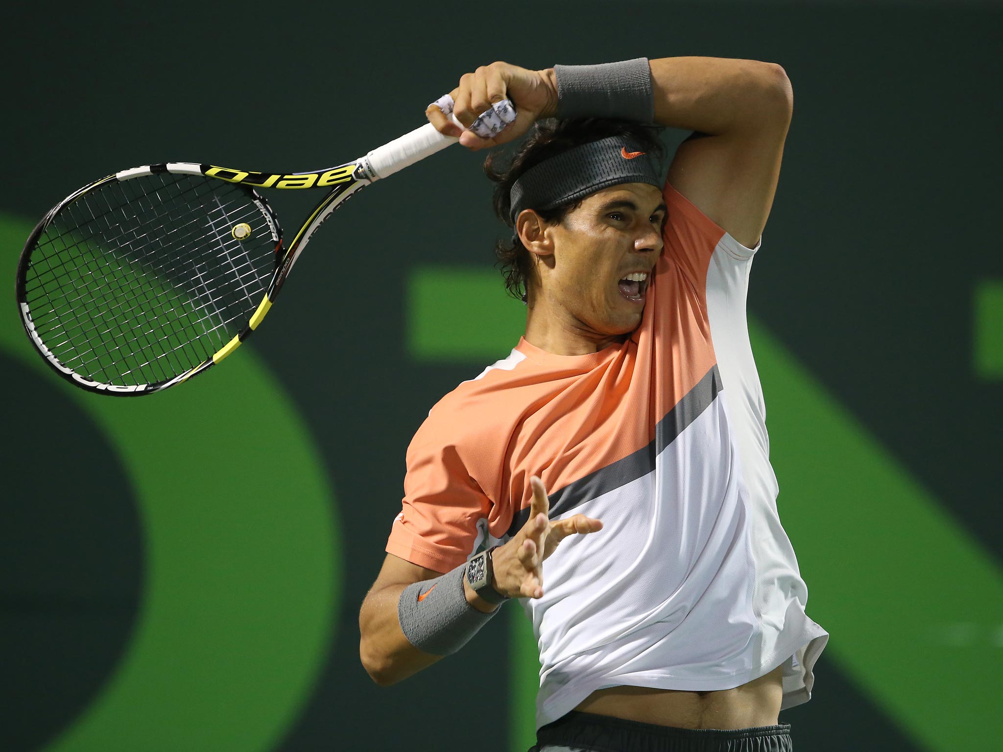 Rafael Nadal battled back from a set down to beat Milos Raonic and book his place in the Sony Open semi-finals