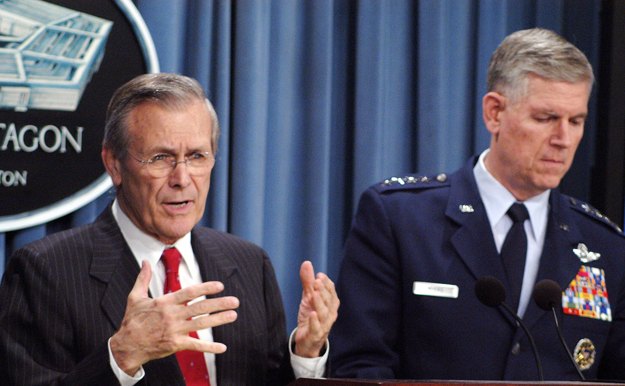 In the firing line: Rumsfeld (left) and Chairman of the Joints Chief of Staff Richard B. Myers field questions on the Iraq war from reporters at the Pentagon in Washington in 2003