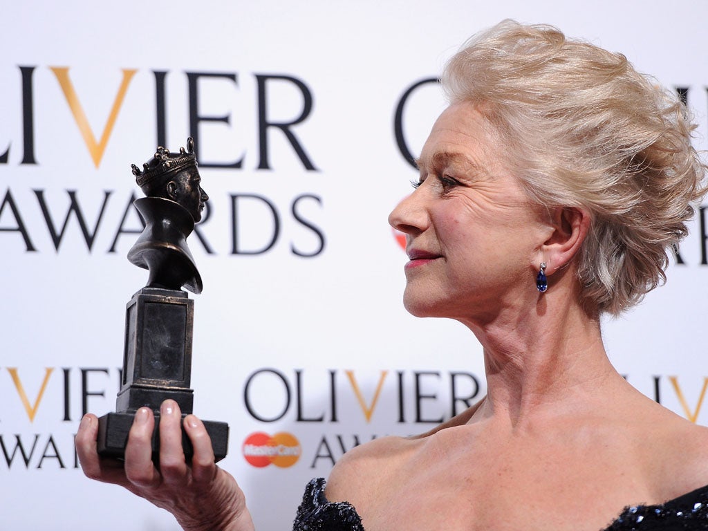 Dame Helen Mirren with her Best Actress award during The Laurence Olivier Awards at the Royal Opera House on April 28, 2013 in London, England.