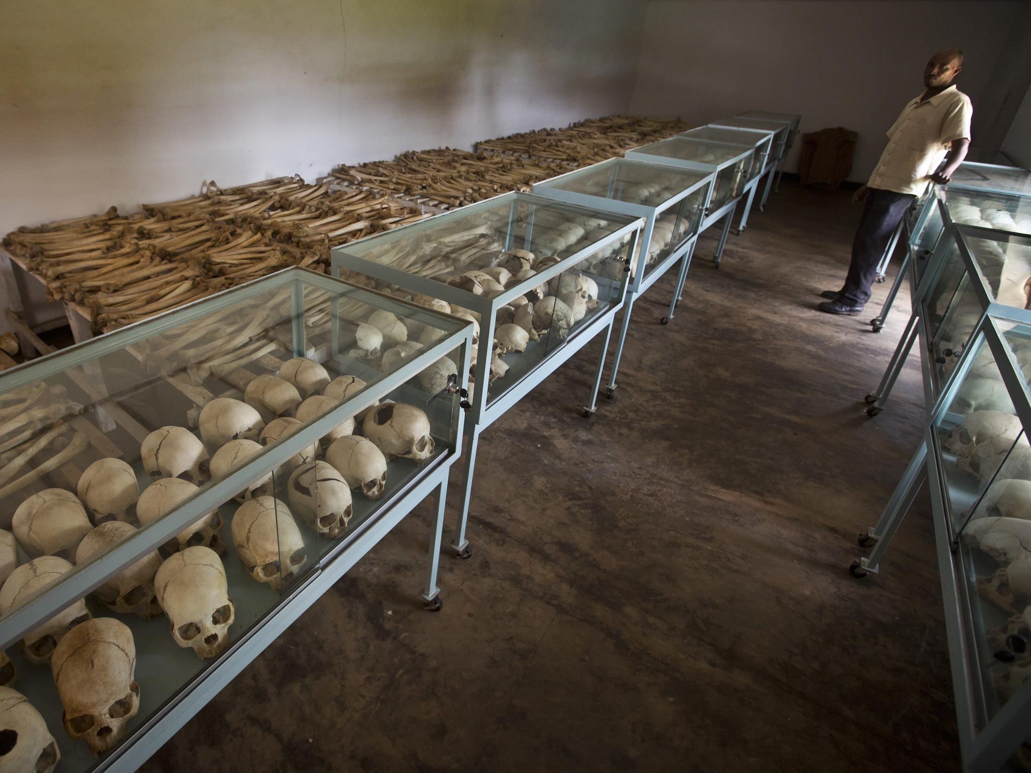 Rows of human skulls and bones that form a memorial to those who died in the redbrick church that was the scene of a massacre in 1994