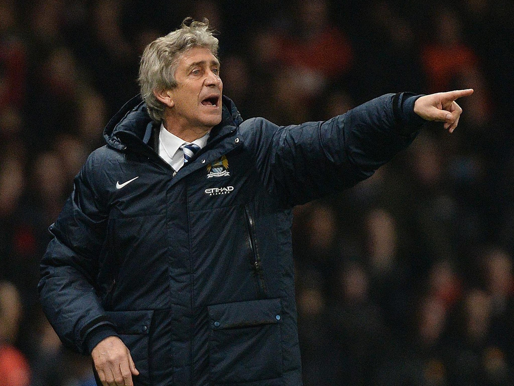 Manuel Pellegrini makes a gesture from the touchline