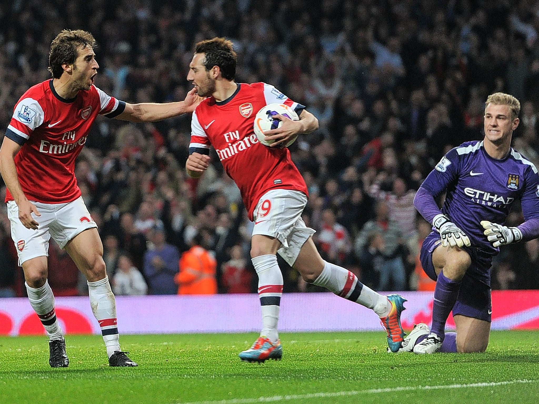 Mathieu Flamini and Santi Cazorla celebrate the former's goal for Arsenal