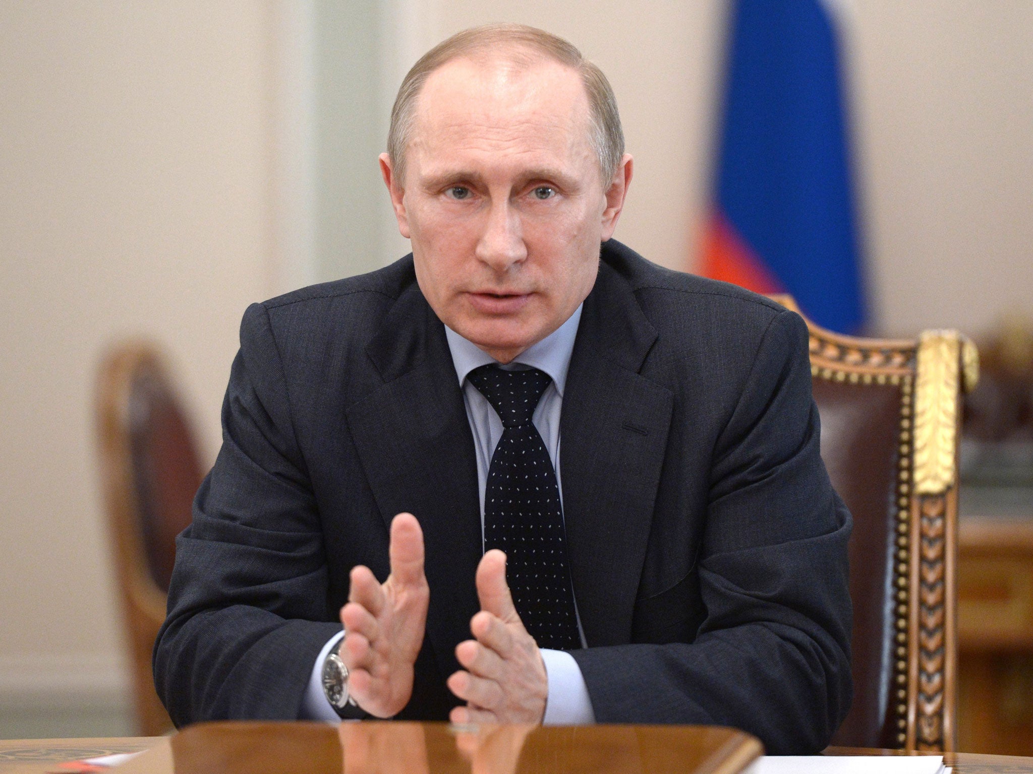 Russia's President Vladimir Putin speaks at a Security Council meeting at the Kremlin in Moscow, on 28 March, 2014