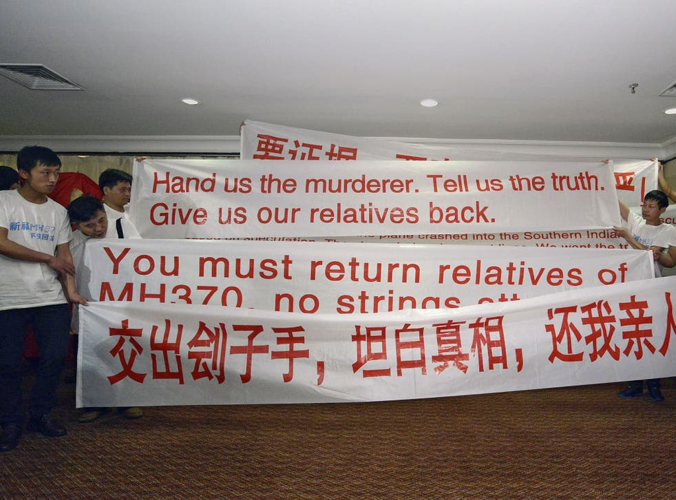 Chinese relatives of the passengers on board the missing Malaysia flight MH370 demand better information from authorities 