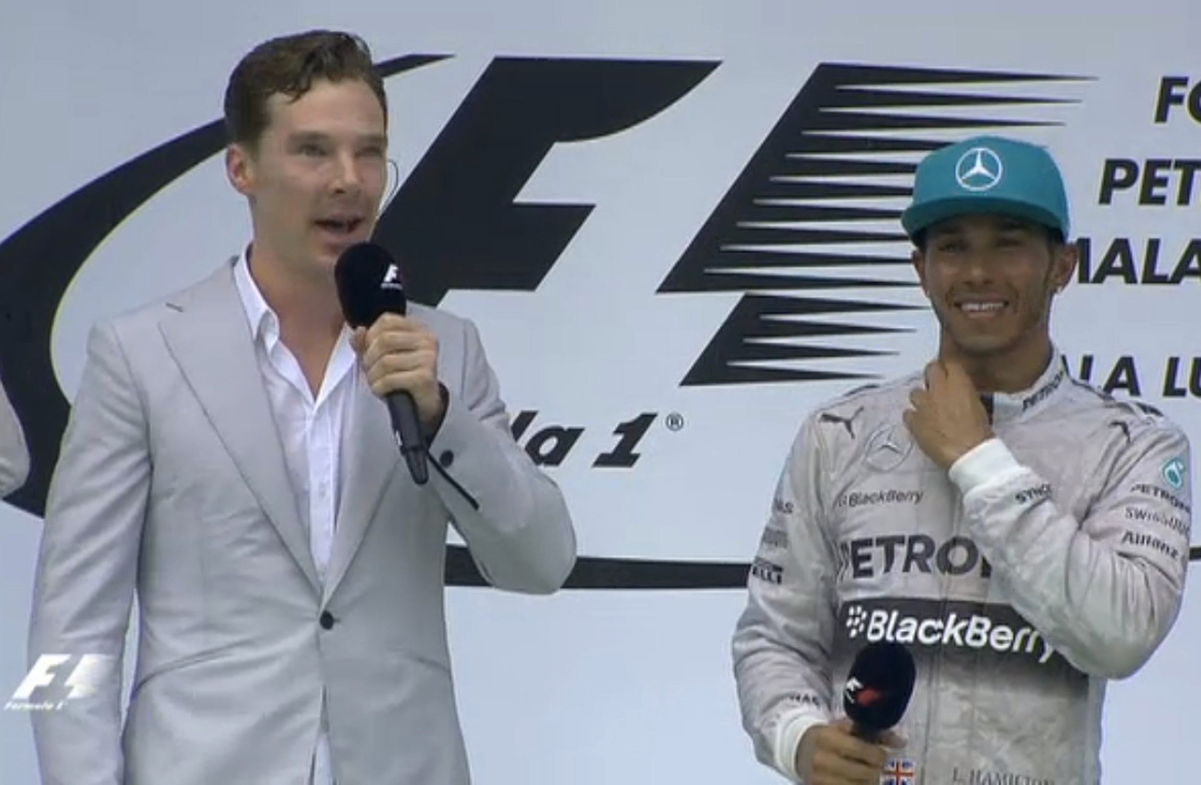 Sherlock star Benedict Cumberbatch interviews Lewis Hamilton on the podium following the Mercedes driver's Malaysian GP victory