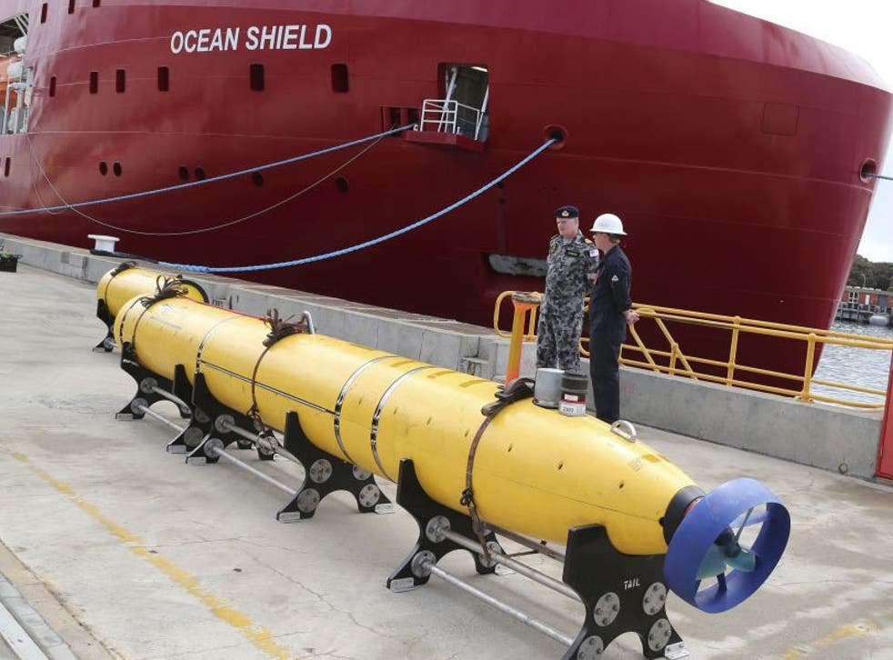 An underwater search-surveying vehicle sits on the wharf ready to be fitted to the defense ship Ocean Shield