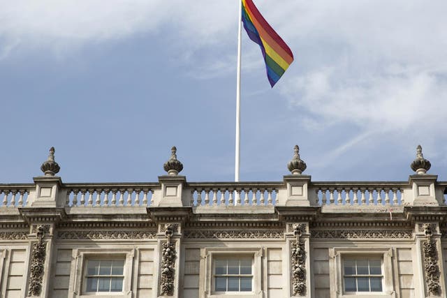 The rainbow flag flies above British Cabinet Offices, marking the first day Britain has allowed same sex marriages, in London