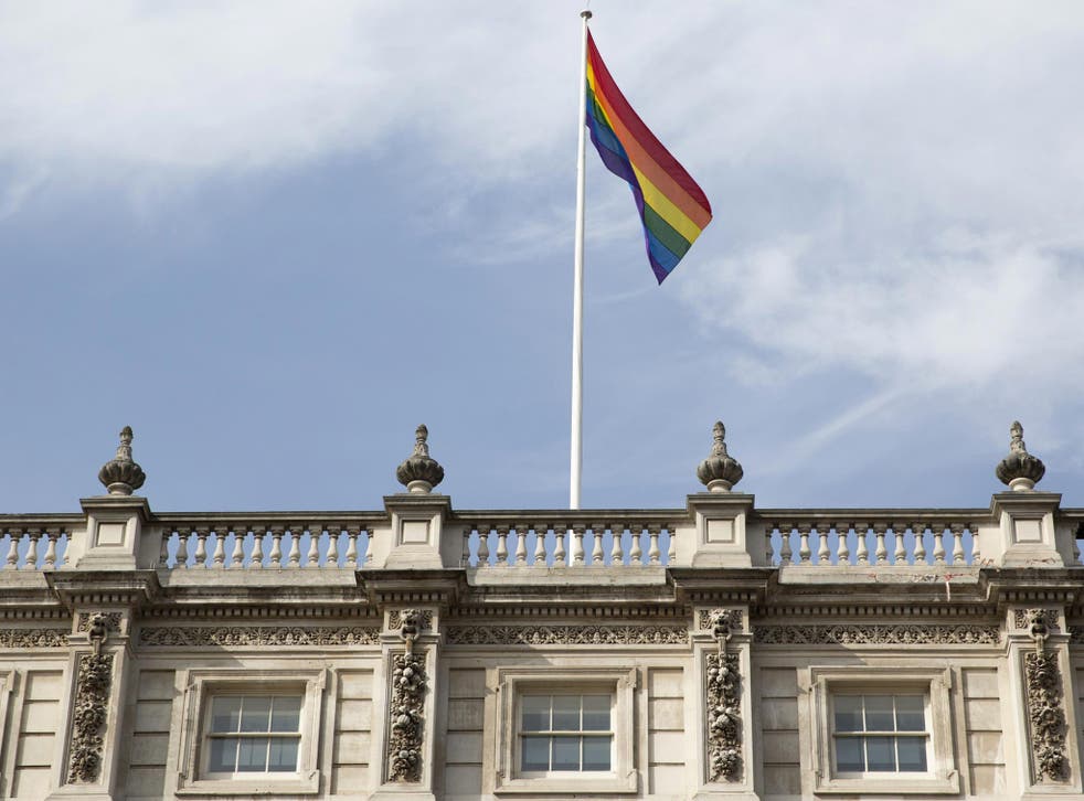 The rainbow flag flies above British Cabinet Offices, marking the first day Britain has allowed same sex marriages, in London