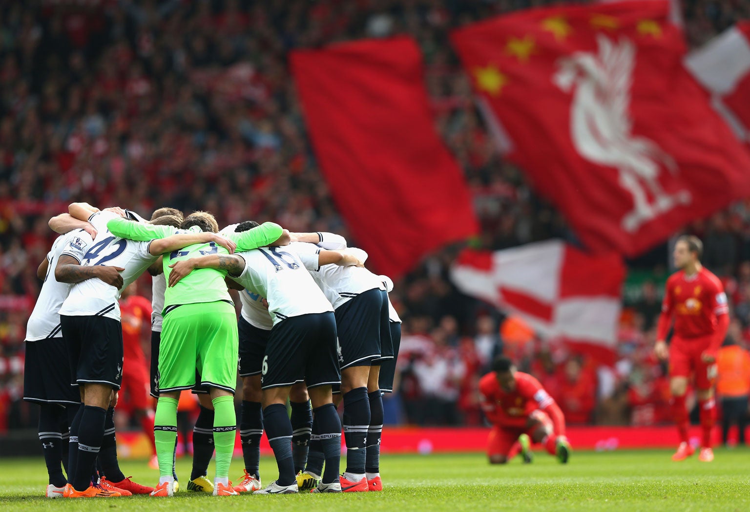 The Spurs players form a huddle prior to the Barclays Premier League match between Liverpool and Tottenham Hotspur at Anfield on March 30, 2014 in Liverpool