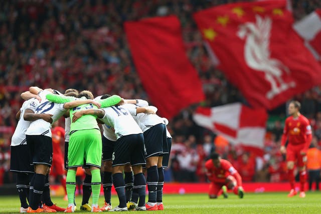 The Spurs players form a huddle prior to the Barclays Premier League match between Liverpool and Tottenham Hotspur at Anfield on March 30, 2014 in Liverpool