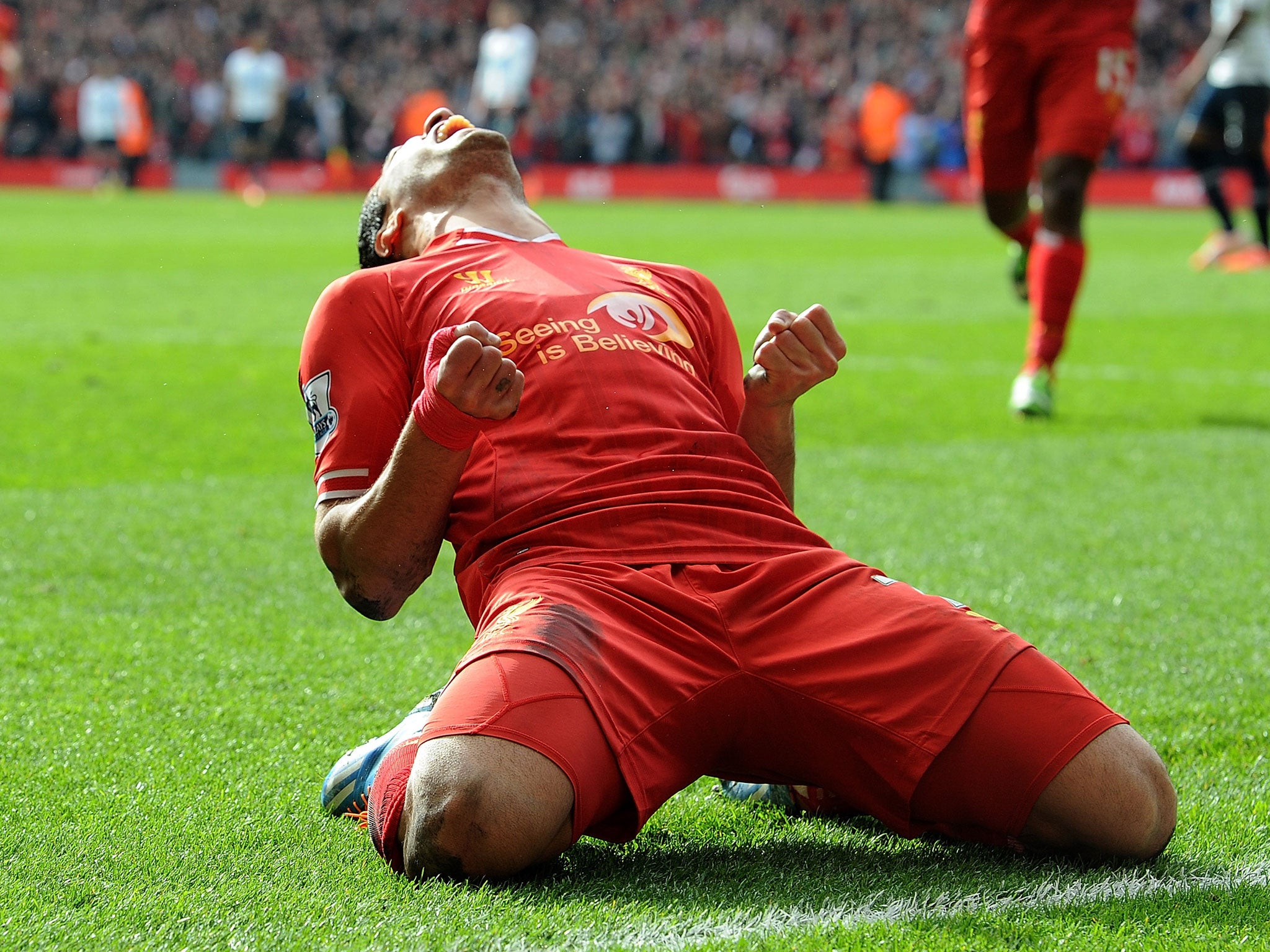 Luis Suarez of Liverpool celebrates the second goal against Tottenham