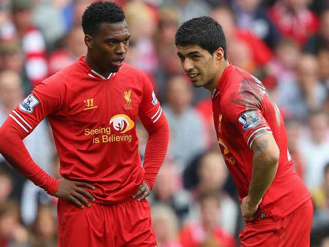 Daniel Sturridge (left) and Luis Suarez speak during Liverpool's 4-0 victory over Tottenham on Sunday