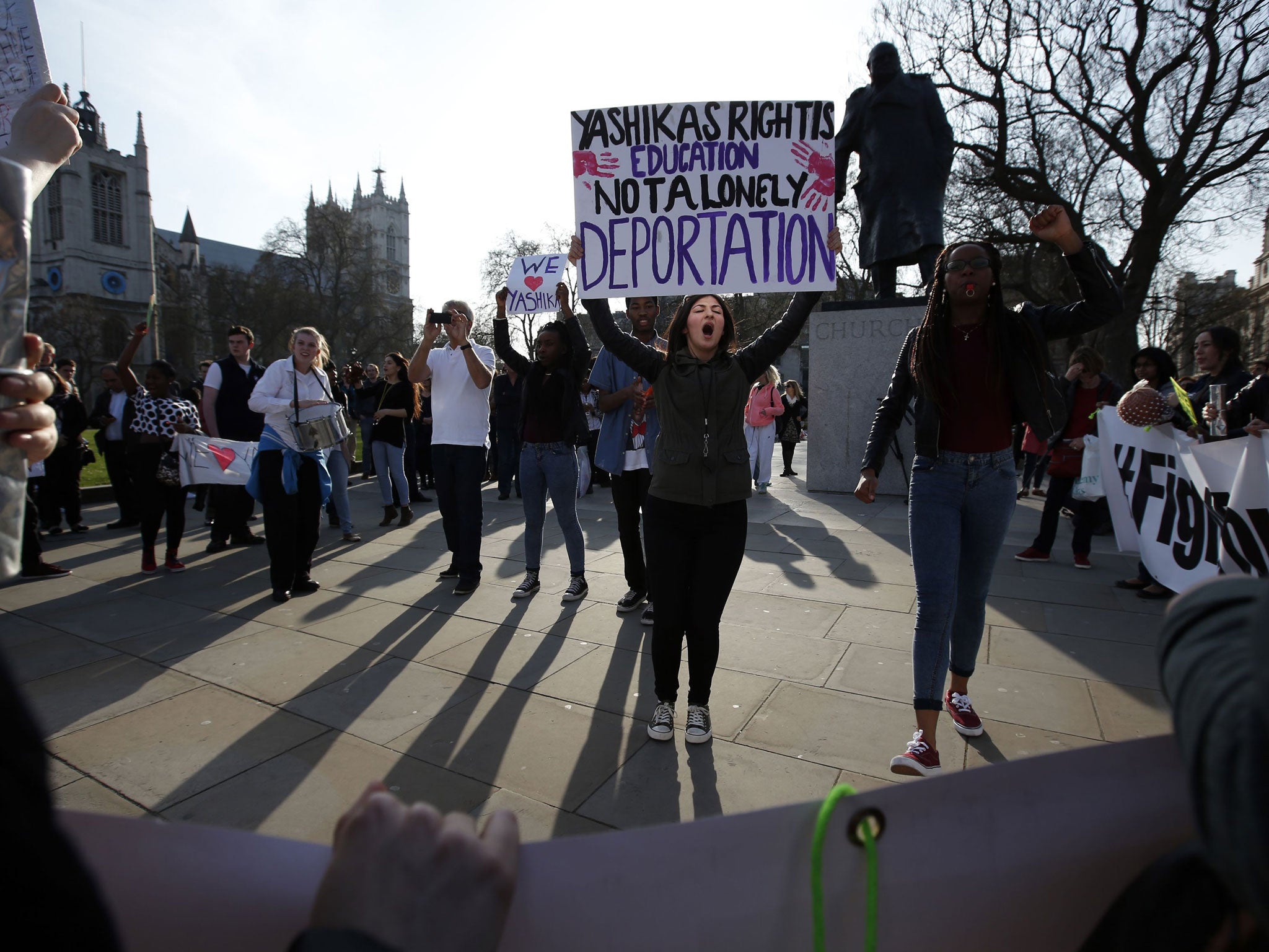 Supporters of Mauritian student Yashika Bageerathi protest in Parliament Square