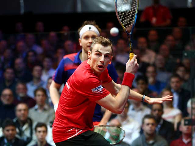 Nick Matthew of England (front) in action against James Willstrop (back) during the final of the Canary Wharf Squash Classic