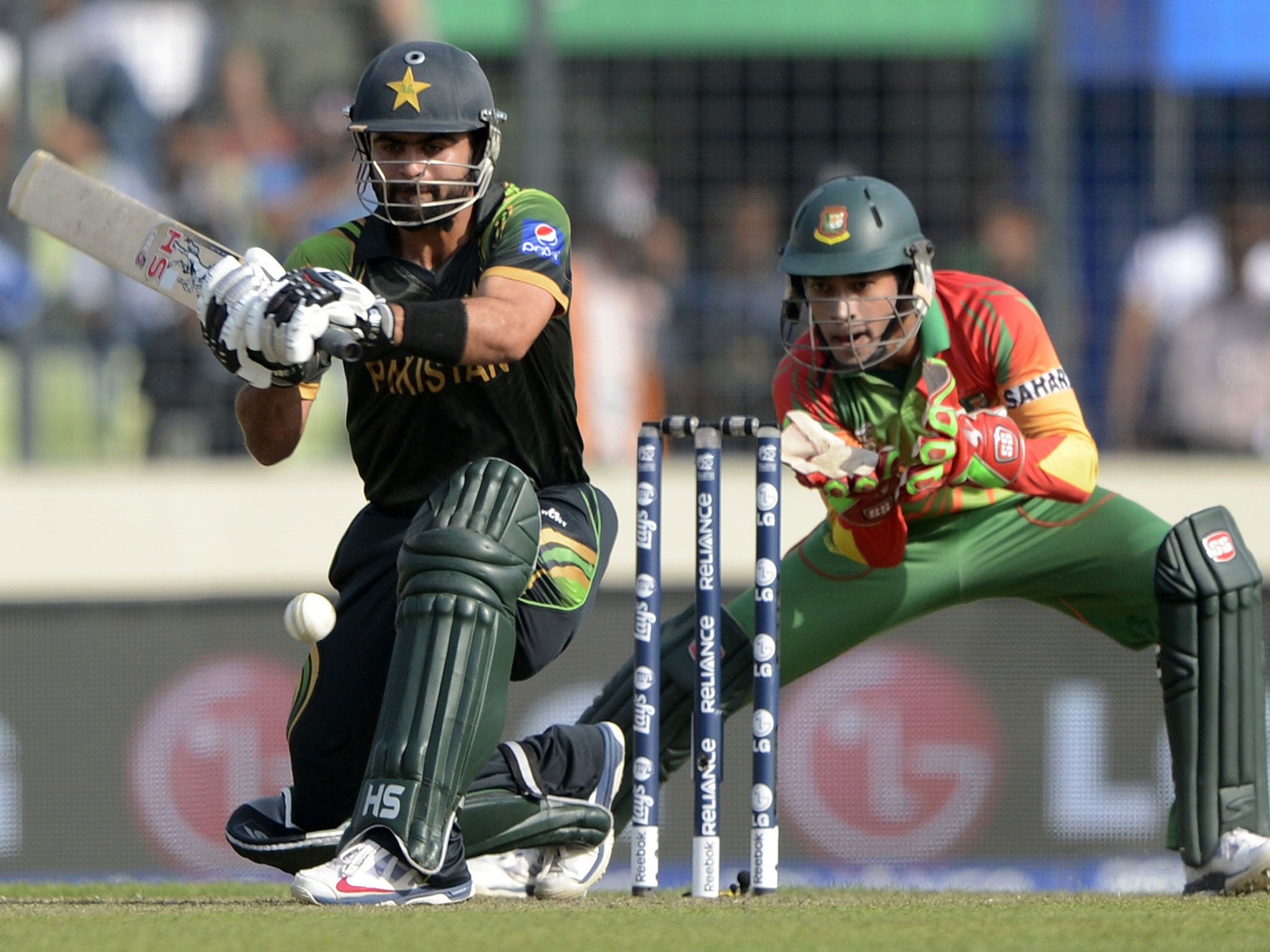 Pakistan’s Ahmed Shehzad sweeps on his way to an unbeaten century
