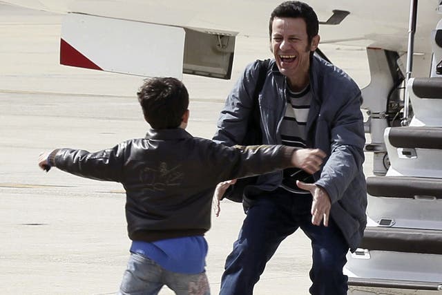Dad’s home at last: the moment of pure joy yesterday when Spanish journalist  Javier Espinosa was reunited with his son after being held hostage in Syria for six months