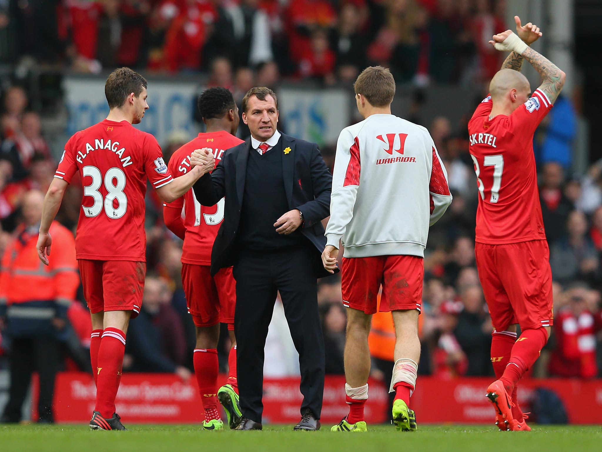 Brendan Rodgers celebrates Liverpool's 4-0 victory over Tottenham with his players
