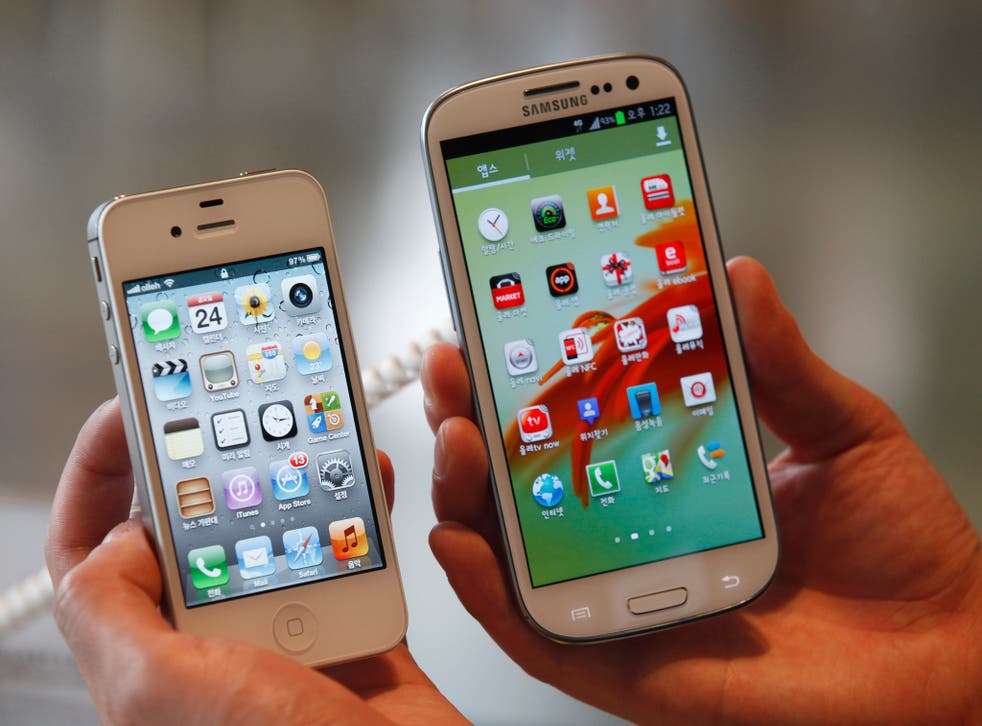 Apple's iPhone 4S (left) is seen next to Samsung's Galaxy SIII.
