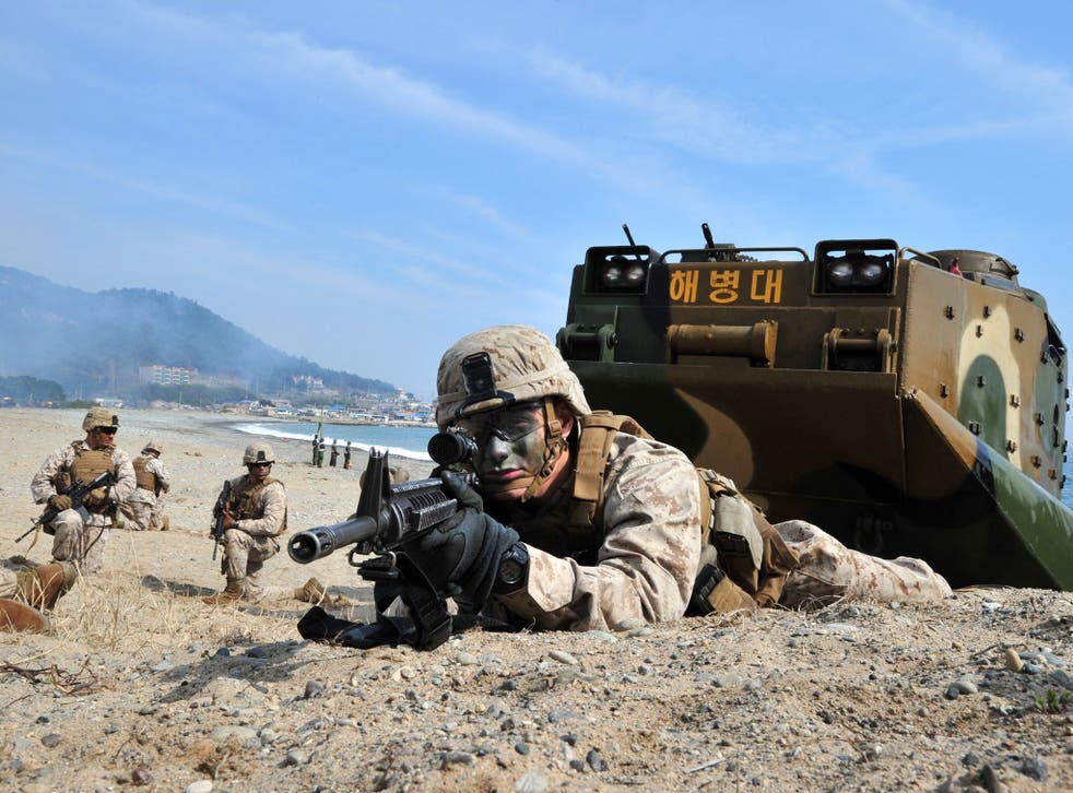 US Marines take a position during a joint landing operation by US and South Korean Marines in Pohang. North Korea announced a live-fire drill near its disputed maritime border with South Korea, further ratcheting up tensions a day after threatening a 'new