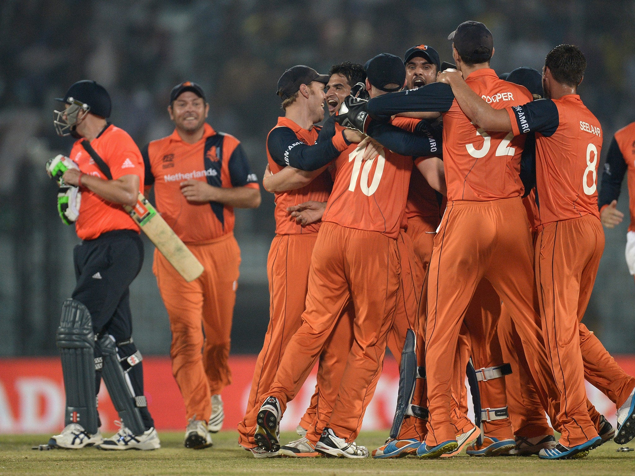 Netherlands players celebrate the final wicket of James Tredwell of England to win the ICC World Twenty20 match