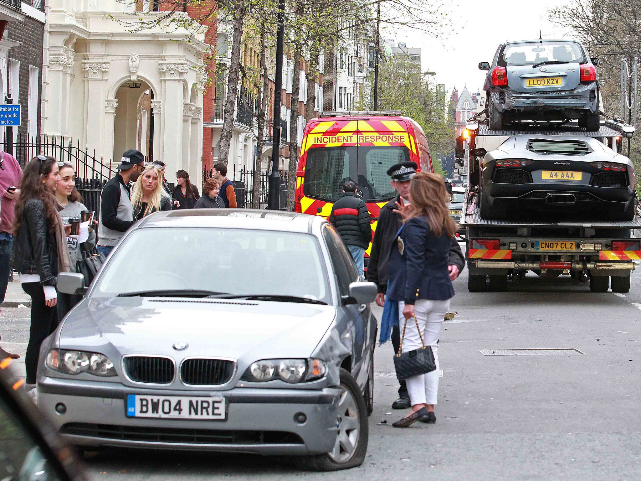 A BMW caught up in a three-car crash involving a Lamborghini Aventador