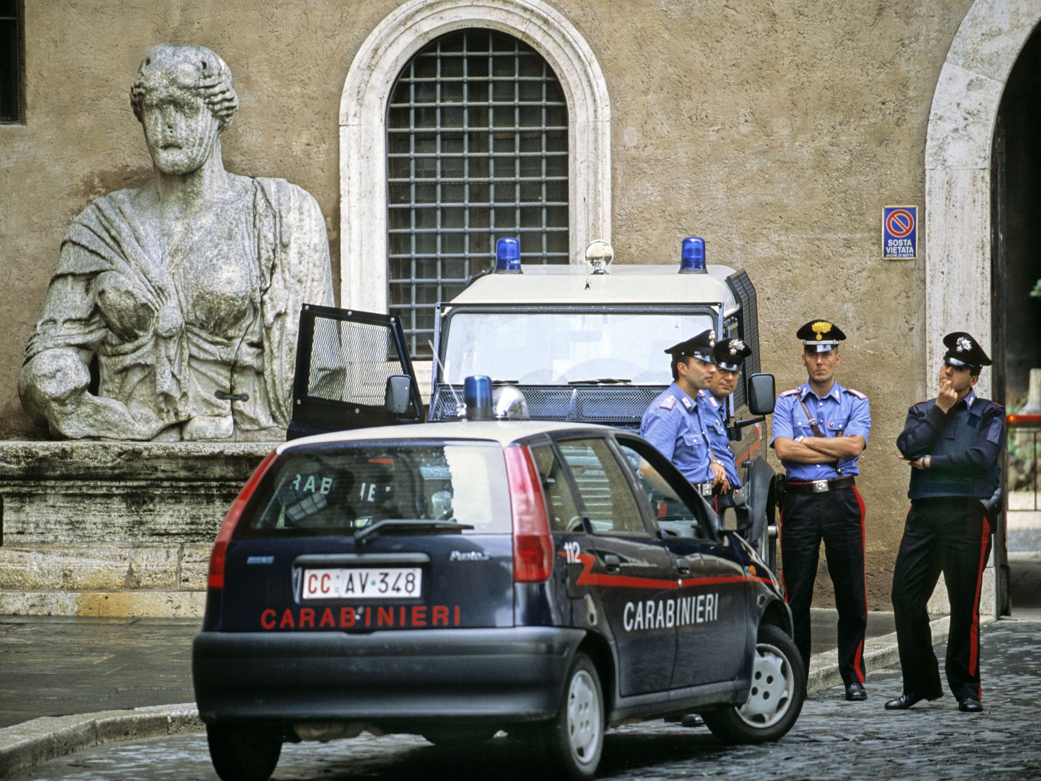 A Carabinieri officer told the court: ‘The body was visible from the door, naked and face down with his hands behind his back. There was an electrical cord round his neck.’