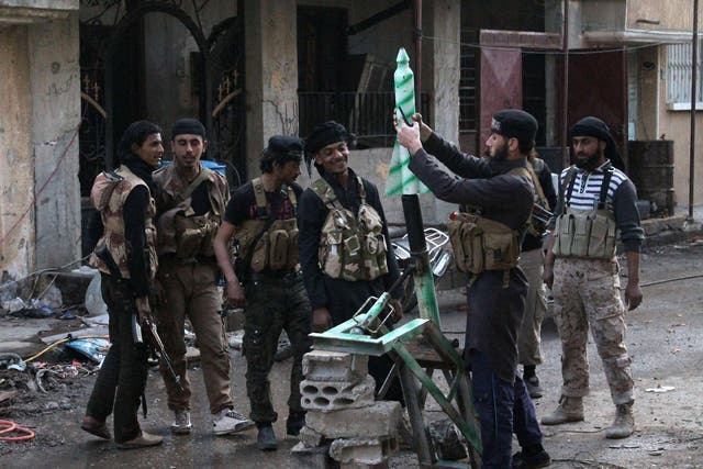Rebel fighters in the eastern Syrian town of Deir Ezzor 