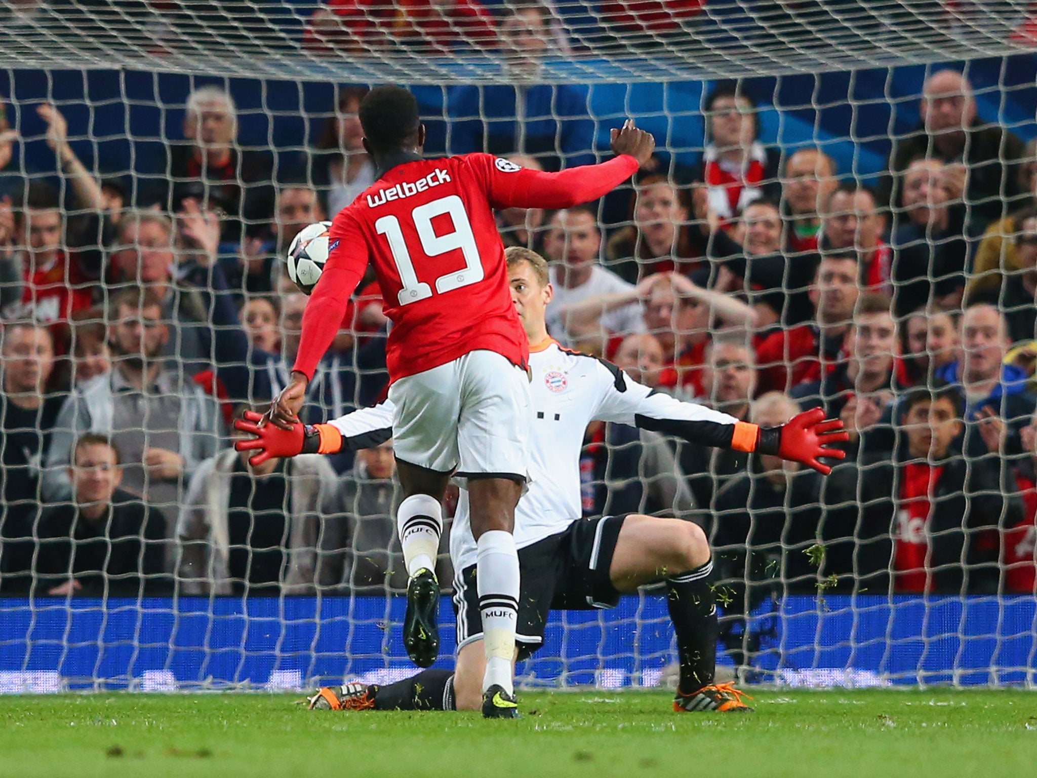 Danny Welbeck sees his chip saved by Manuel Neuer