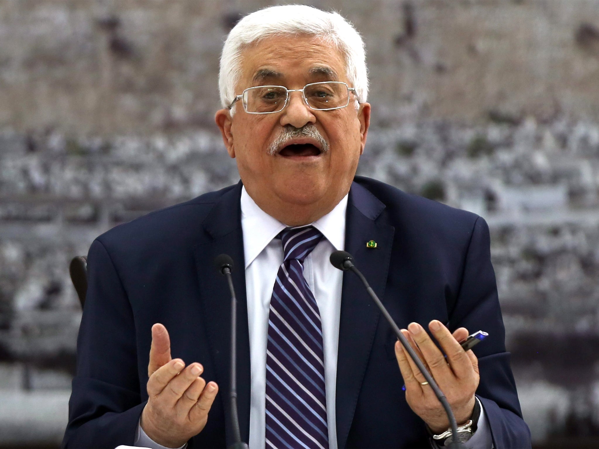 President Mahmoud Abbas chairs a meeting of the Palestinian leadership to discuss Israeli-Palestinian peace talks at his headquarters in the West Bank town of Ramallah