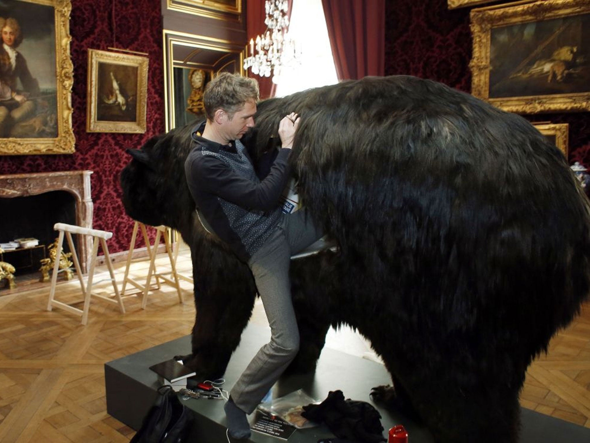 French artist Abraham Poincheval climbs into a bear.