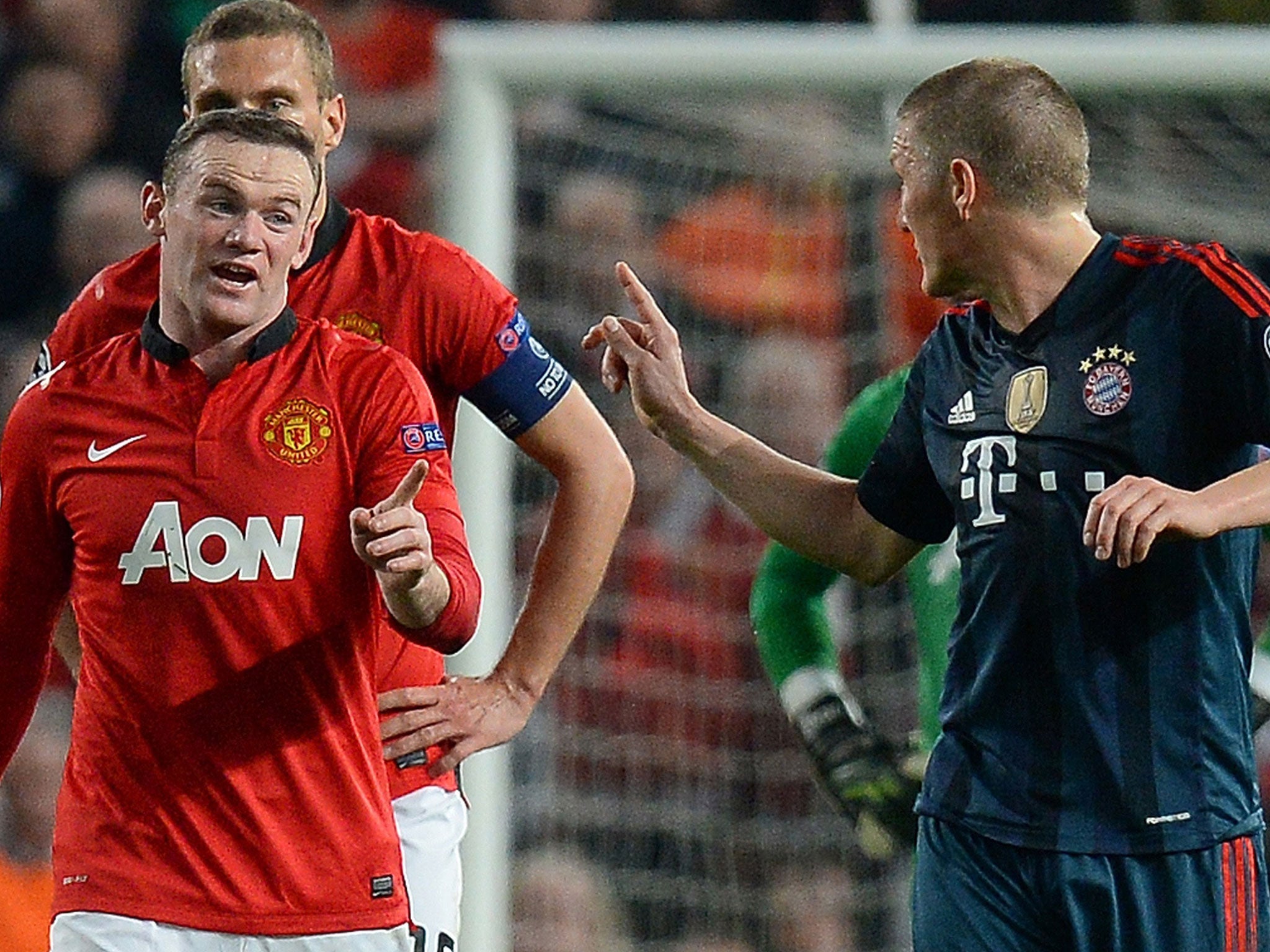 Bastian Schweinsteiger argues with Wayne Rooney after being sent off at Old Trafford